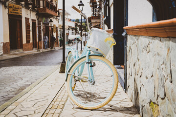 Retiro, Antioquia / Colombia. May 5, 2019. Old bicycle on the street on the wall