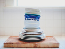 Stack Of Dishes On Cutting Board