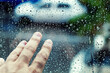 © MyMicrostock/Stocksy - Hand Touching a Glass with Water Drops