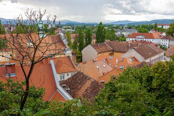 Bird's-eye view of the tiled roofs of an old European city