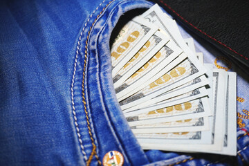 Money hundred dollar bills in your jeans pocket