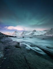 Wall Mural - aurora borealis, senja islands, norway. northen lights, mountains and reflection on the water. winte