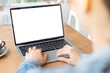 © panitan - computer mockup blank screen.hand woman work using laptop with white background for advertising,contact business search information on desk at coffee shop.marketing and creative design