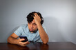 © Antonio Tanaka - Wavy hair young hispanic man using smart phone and showing various emotions