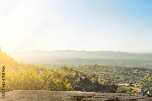 Fotomural Green hills with landscape view