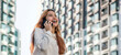 happy asian woman talking with mobile phone on high building