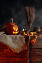 Halloween Pumpkins On A Old Wooden Background. Conceptual Still Life On The Theme Of Halloween.
