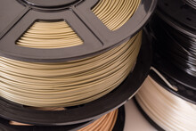 Spool Of Bronze PLA Plastic Filament For 3D Printer.