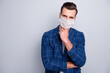 Portrait of his he nice attractive executive healthy guy wearing safety mask flu contamination mers cov infection prevention thinking deciding isolated over light grey pastel color background