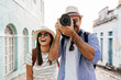 © kleberpicui - Happy tourist couple taking pictures. Travel and love concept in Latin America