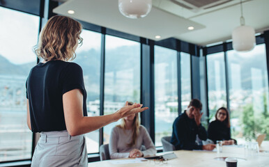 female entrepreneur making a presentation at work