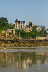 Wall Mural - Sand beach and historic villas in Dinard, a popular seaside resort on the french Atlantic ocean coast in Brittany, France.