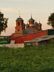 Poster - Old stone church in the village at sunset