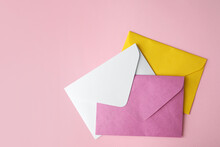 Colorful Paper Envelopes On Pink Background, Flat Lay
