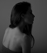 © Anastasia.photoyoga - Beautiful makeup sexy woman with nude back on grey background with empty copy space. Closeup profile view portrait. Art.