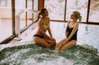 © BGStock72 - Young women sitting and relaxing by the whirlpool bathtub