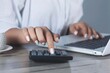© Alla - woman hand calculator