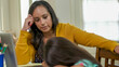 © JHDT Productions - Mom struggling to help her kindergartener with virtual classroom learning