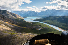 Aerial View From Helicopter Of Rocky Mountains With Turquoise Lake And Blue Sky At Banff National Park