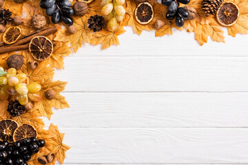 Wall Mural - top view of autumnal decoration on white wooden background