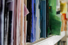 Close Up Art Glass Sheets Organized By Color In Studio