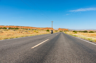 Wall Mural - Long straight road ahead through desert of New Mexico, USA.