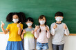 © JR-50 - Diversity of children students wearing medical masks in the classroom