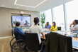 © Martin Barraud/Caia Image - Business people video conferencing in conference room meeting