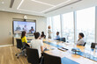 © Martin Barraud/Caia Image - Business people video conferencing in conference room meeting