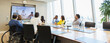 © Martin Barraud/Caia Image - Business people video conferencing in conference room meeting