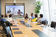 © Martin Barraud/Caia Image - Business people video conferencing in conference room meeting