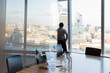© Martin Barraud/Caia Image - Thoughtful businessman at highrise office window, London, UK
