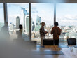 © Tom Merton/Caia Image - Business people talking at highrise office window, London, UK