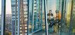 © Chris Ryan/Caia Image - Business people meeting at highrise office window