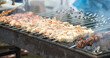 © schankz - Meat on metal skewers is fried on the grill
