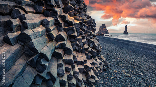 Unbelievable sunset on Reynisdrangar cliffs in Atlantic ocean. Spectacular summer scene of black sand beach in Iceland, Vik location, Europe. Beauty of nature concept background. © Andrew Mayovskyy