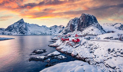 magic sunset on popular tourist destination - hamnoy port with festhaeltinden mount on background, n