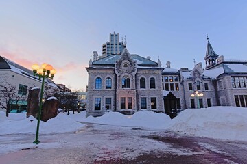 Former Ottawa Teachers` College, gothic revival heritage building that is par of the city hal of Ottawa, captial f Canada on a winter morning with snow 