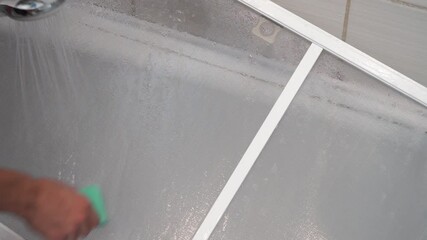 Washing the mosquito net in the bathroom