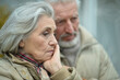 © aletia2011 - Portrait of sad thoughtful senior couple in park