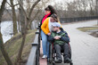 © Светлана Лазаренко - A man with his family in a wheelchair