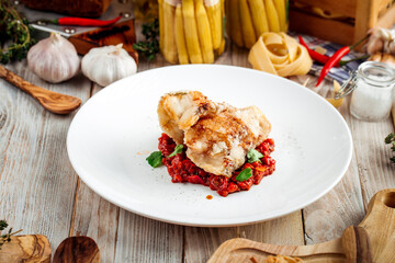Wall Mural - Fried white fish with vegetables stew in red sauce