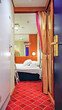 Bunk or folding beds inside children or kids bedroom, cabin or stateroom of suite onboard modern cruiseship or cruise ship liner