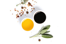 Various Spices, Herbs, Olive Oil And Balsamic Vinegar On A White Background Top View. Free Space For Text. Food Background, Ingredients For Cooking.
