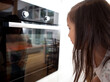 © Tyler Olson/Stocksy - Child Watching Cookies in Oven