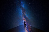 Fototapeta Kosmos - Man walking through the universe