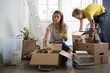 © Lumina/Stocksy - Couple Unpacking After Moving In