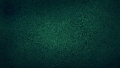 blank green texture surface background with dark corners. green grainy cement wall background with space for text.