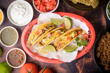 hard shell taco in red plastic basket