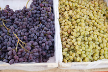 Two Types Of Grapes For Sale In The Market